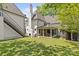 Expansive backyard with an outdoor kitchen, patio, and a lush lawn, creating the perfect outdoor retreat at 2200 Hastings Dr, Charlotte, NC 28207