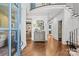 Bright foyer featuring hardwood floors, a curved staircase, and stylish console table with decorative accents at 2200 Hastings Dr, Charlotte, NC 28207