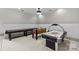 Spacious game room with shuffleboard, foosball, and air hockey tables for entertainment at 2200 Hastings Dr, Charlotte, NC 28207