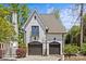 Detached two-car garage with classic doors, a basketball hoop, and charming curb appeal at 2200 Hastings Dr, Charlotte, NC 28207