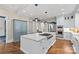 Bright kitchen with a large island, stainless appliances, hardwood floors, and white cabinetry at 2200 Hastings Dr, Charlotte, NC 28207