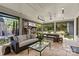 Spacious patio with stylish furniture, outdoor dining, and a beautiful backyard view with a treehouse at 2200 Hastings Dr, Charlotte, NC 28207