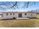 Home's backyard, featuring a patio and well-kept lawn at 2232 Glenraven Ave, Gastonia, NC 28052