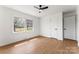 Bedroom featuring hardwood floors, a window, and a ceiling fan at 2232 Glenraven Ave, Gastonia, NC 28052