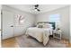 Bright bedroom featuring a large bed, ceiling fan, and natural light at 2232 Glenraven Ave, Gastonia, NC 28052
