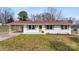 Charming single-story home with white brick, a red roof, and well-maintained lawn at 2232 Glenraven Ave, Gastonia, NC 28052