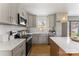 Modern kitchen with stainless steel appliances, lots of counter space and a beautiful backsplash at 2232 Glenraven Ave, Gastonia, NC 28052