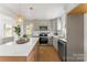 Modern kitchen featuring a large island, stainless steel appliances, and stylish pendant lighting at 2232 Glenraven Ave, Gastonia, NC 28052