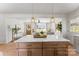 Bright, open-concept living and dining area featuring a large island and hardwood floors at 2232 Glenraven Ave, Gastonia, NC 28052