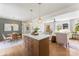 Open-concept living and dining area featuring a large island, dining table, and comfortable seating at 2232 Glenraven Ave, Gastonia, NC 28052