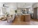 Open-concept living room and kitchen with hardwood floors and stainless steel appliances, ideal for entertaining at 2232 Glenraven Ave, Gastonia, NC 28052