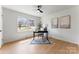 Well-lit office space with large window, desk, ceiling fan and hardwood floors at 2232 Glenraven Ave, Gastonia, NC 28052