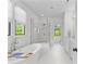 Bright white bathroom featuring a soaking tub, glass-enclosed shower, and double vanity at 2316 Westminster Pl, Charlotte, NC 28207