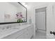 Bright bathroom with double sinks, marble countertops, and view to the toilet at 2316 Westminster Pl, Charlotte, NC 28207