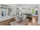 Elegant dining room connecting to the kitchen with a modern table, seating for six and natural light at 2316 Westminster Pl, Charlotte, NC 28207
