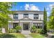Charming white two-story home with black trim, manicured landscaping, and inviting front entrance at 2316 Westminster Pl, Charlotte, NC 28207