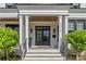 Welcoming front entrance with stylish double doors, stone steps, and classic architectural details at 2316 Westminster Pl, Charlotte, NC 28207