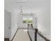 Bright hallway with natural light, decorative lighting fixtures, and classic hardwood floors at 2316 Westminster Pl, Charlotte, NC 28207