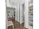 Light-filled hallway featuring hardwood floors, stylish built-in shelving, and tasteful decor at 2316 Westminster Pl, Charlotte, NC 28207