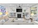 Cozy living room with a fireplace, built-in shelving, a ceiling fan, and comfortable seating at 2316 Westminster Pl, Charlotte, NC 28207