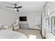 Bright main bedroom with neutral furniture, ceiling fan, and natural light from large windows at 2316 Westminster Pl, Charlotte, NC 28207