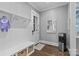 Functional mudroom with bench, storage baskets, coat hooks, and a convenient water cooler at 2316 Westminster Pl, Charlotte, NC 28207