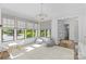Bright playroom with large windows, modern chandelier, and cozy beanbag chairs at 2316 Westminster Pl, Charlotte, NC 28207