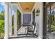 Relaxing porch with rocking chairs, wooden ceiling, and view of backyard at 2316 Westminster Pl, Charlotte, NC 28207