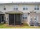 Exterior of the home with a cozy screened-in porch and air conditioning units at 2388 Loch Stone Dr # E, Gastonia, NC 28054