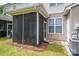 Close up of the home's screened-in porch and air conditioning units at 2388 Loch Stone Dr # E, Gastonia, NC 28054