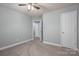 Clean, carpeted bedroom with a ceiling fan and neutral paint at 2388 Loch Stone Dr # E, Gastonia, NC 28054