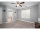 Bright bedroom features neutral tones, carpeted floor, and an ensuite bathroom at 2388 Loch Stone Dr # E, Gastonia, NC 28054