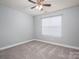 Bright bedroom features neutral tones, carpeted floor, and a ceiling fan at 2388 Loch Stone Dr # E, Gastonia, NC 28054