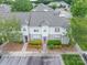 Charming townhouse with landscaped front yard, neutral siding, and gray shingle roof at 2388 Loch Stone Dr # E, Gastonia, NC 28054