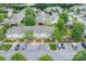 Aerial view highlights the townhome's location with parking and well-kept landscaping at 2388 Loch Stone Dr # E, Gastonia, NC 28054