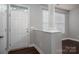 Bright foyer featuring hardwood floors, a white door, and natural light at 2388 Loch Stone Dr # E, Gastonia, NC 28054