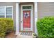 Inviting front door with decorative wreath and well-maintained landscaping at 2388 Loch Stone Dr # E, Gastonia, NC 28054