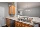 This kitchen features a double stainless steel sink and ample countertop space for meal preparation at 2388 Loch Stone Dr # E, Gastonia, NC 28054