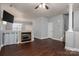 Spacious living room with hardwood floors, fireplace, and open layout at 2388 Loch Stone Dr # E, Gastonia, NC 28054