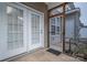 Enclosed patio featuring a concrete floor and two doors for outdoor living and relaxation at 2388 Loch Stone Dr # E, Gastonia, NC 28054