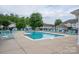 Community pool with clear blue water, lounge chairs, and meticulously kept pool deck at 2388 Loch Stone Dr # E, Gastonia, NC 28054
