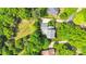Aerial view of a home featuring a pool, patio, and mature trees at 2417 Hamilton Mill Rd, Charlotte, NC 28270