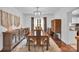 Spacious dining room features hardwood floors, large table, and a buffet cabinet at 2417 Hamilton Mill Rd, Charlotte, NC 28270