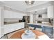 Bright kitchen featuring white cabinets, granite countertops, and stainless steel appliances at 2417 Hamilton Mill Rd, Charlotte, NC 28270