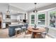 Eat-in kitchen with blue island, granite countertops, and stainless steel appliances at 2417 Hamilton Mill Rd, Charlotte, NC 28270