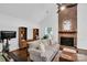 Cozy living room with fireplace, hardwood floors, and neutral decor at 2417 Hamilton Mill Rd, Charlotte, NC 28270