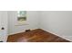 Bedroom featuring hardwood floors, a window and neutral colored walls at 2515 Danforth Ln, Charlotte, NC 28208
