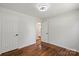 Bright bedroom features hardwood floors, white walls, and white doors for a clean, modern feel at 2515 Danforth Ln, Charlotte, NC 28208