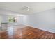 Open-concept living space with hardwood flooring and an adjacent kitchen area at 2515 Danforth Ln, Charlotte, NC 28208