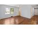 Bright living room featuring hardwood floors, neutral paint, a ceiling fan and natural light at 2515 Danforth Ln, Charlotte, NC 28208